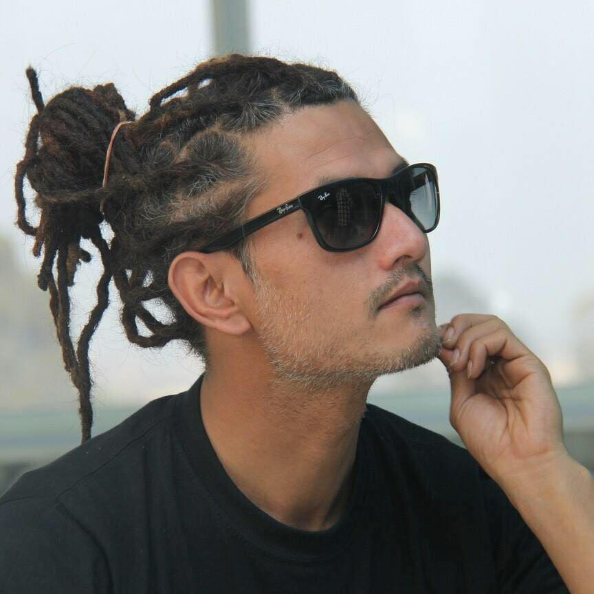 Arpan Thapa background portrait